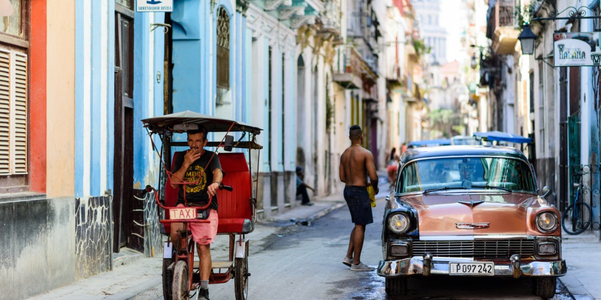 cuban man on a bicycle taxi
