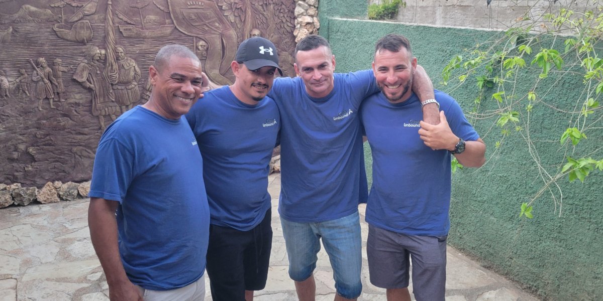 group of four standing together in Cuba