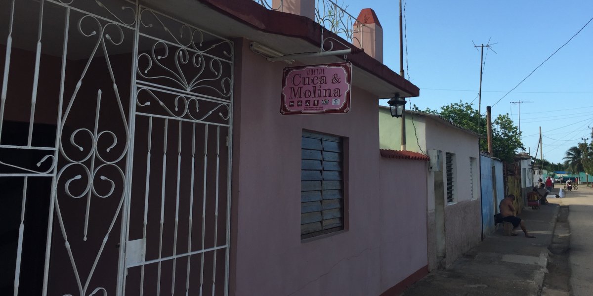 The outside of a Cuban Casa Particular for Cuban Nationals with a sign 