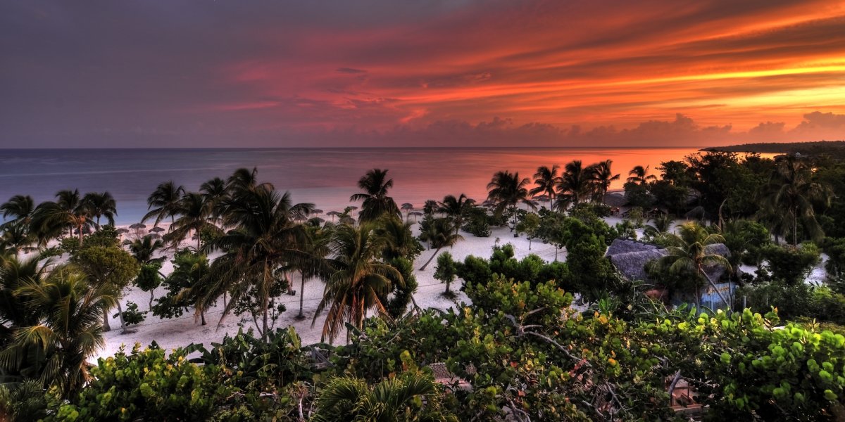 A beach in Holguin, Cuba at sunset 