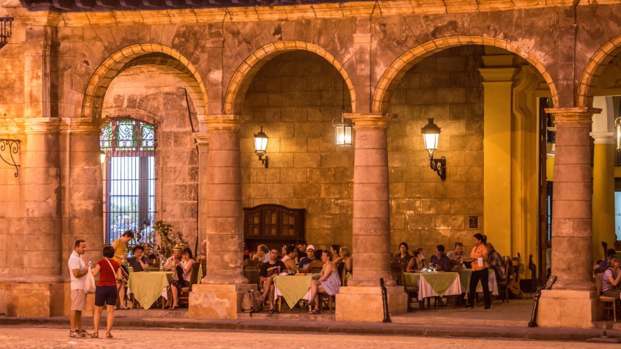 The courtyard of an outdoor restaurant in Havana Cuba at night