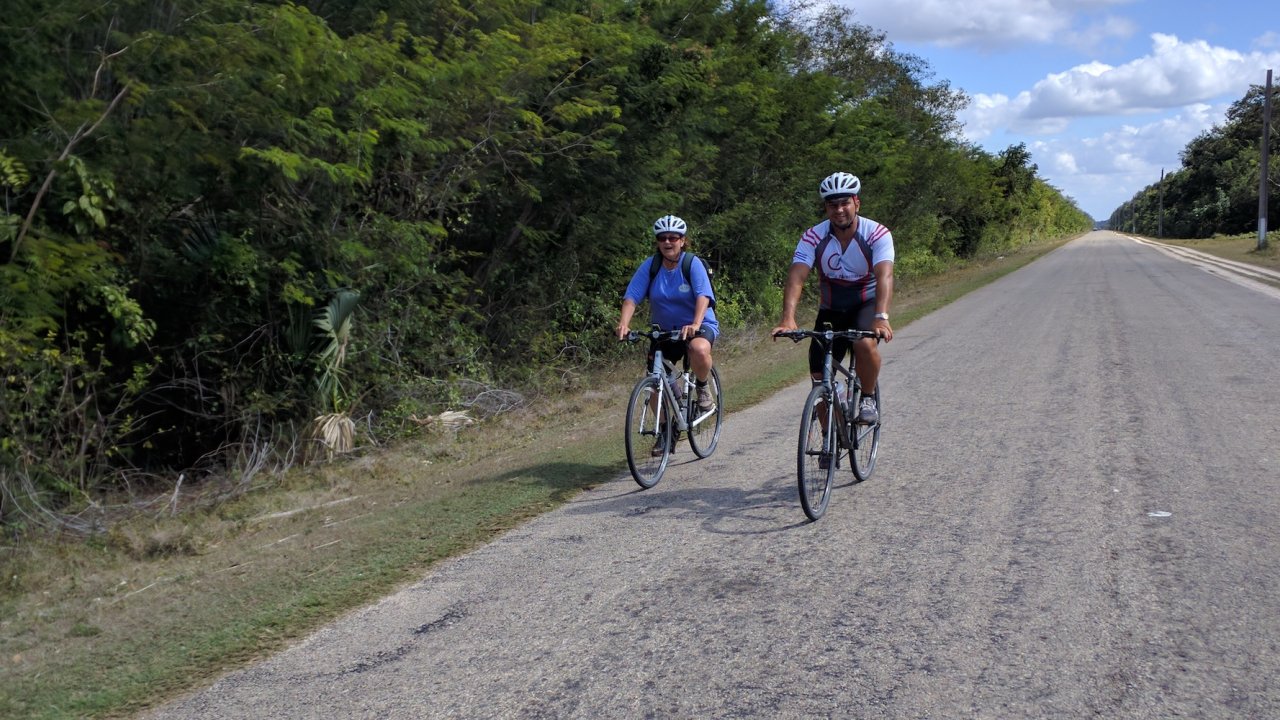 Two people road biking in Cuba