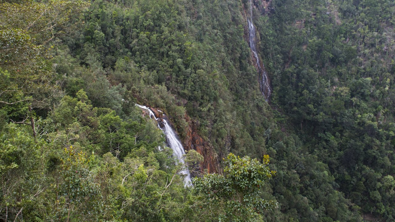 A waterfall in a thick forrest in a national park in Cuba