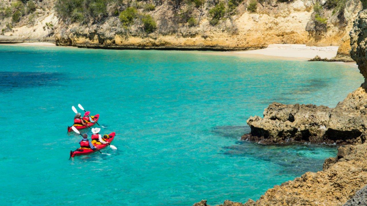 Sea kayaks in turquoise water in Cuba