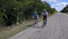 Two people road biking in Cuba