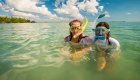 Two girls with snorkel masks in the Caribbean