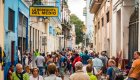 Tourists crowd the colorful streets of Havana, Cuba, during a stop on a guided bike tour of Cuba, showcasing the vibrant culture and energy of cycle Cuba tours.