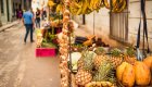 Fresh tropical produce at a local Havana market, featuring pineapples, bananas, and garlic — a highlight of a Cuban street food tour.